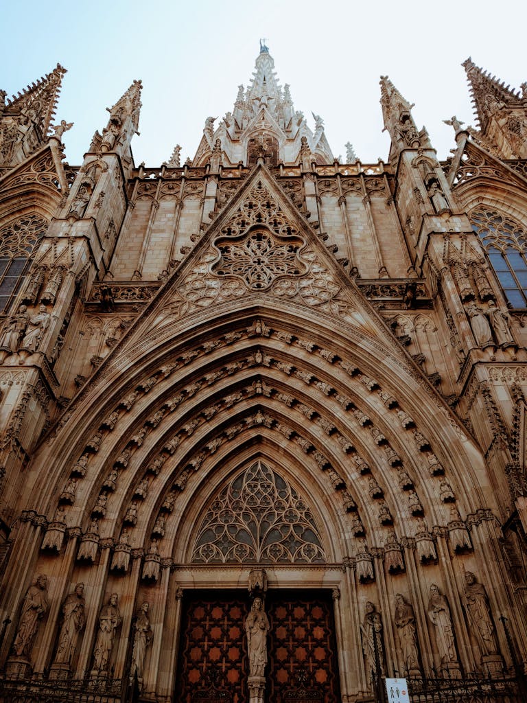 Intricate gothic architecture of the Barcelona Cathedral facade, a historic landmark in Spain.