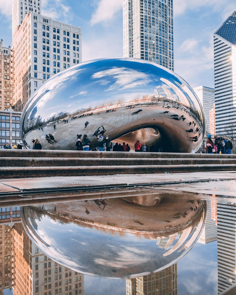 Stunning reflection of Cloud Gate sculpture, known as The Bean, in downtown Chicago's Millennium Park.
