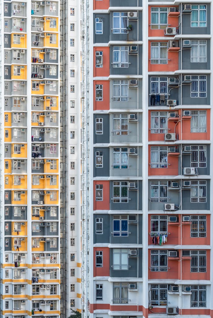 Vibrant high-rise buildings showcasing modern architectural design in urban Hong Kong.